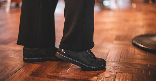 Restaurant staff member wearing durable Mavi black work shoes