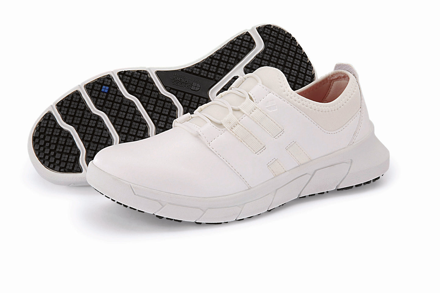 The Karina White by Lila from Shoes For Crews are black slip-resistant trainers that are lightweight and have Flex Tread technology, pair seen from the left side and the sole.