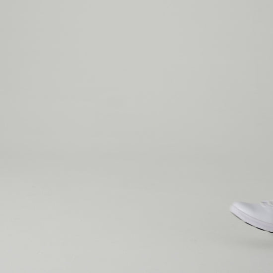 The Karina White by Lila from Shoes For Crews are black slip-resistant trainers that are lightweight and have Flex Tread technology, product video.