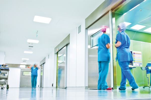 Hospital staff wearing PPE for surgery