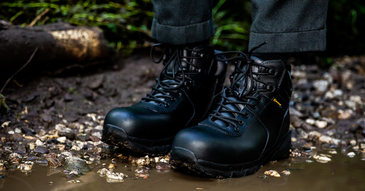 Military officer wearing Shoes For Crews Guard boot standing next to puddle